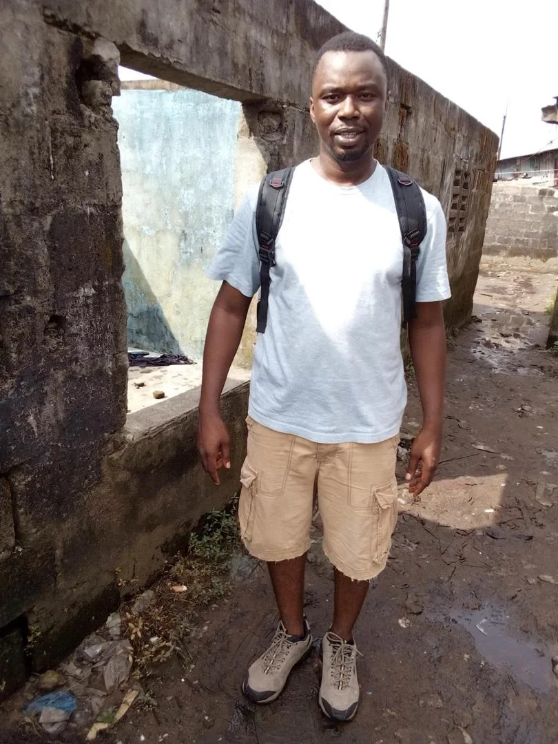 Phillip Garjay Innis during his fieldwork in Clara Town, an informal settlement in Monrovia, Liberia in October 2019